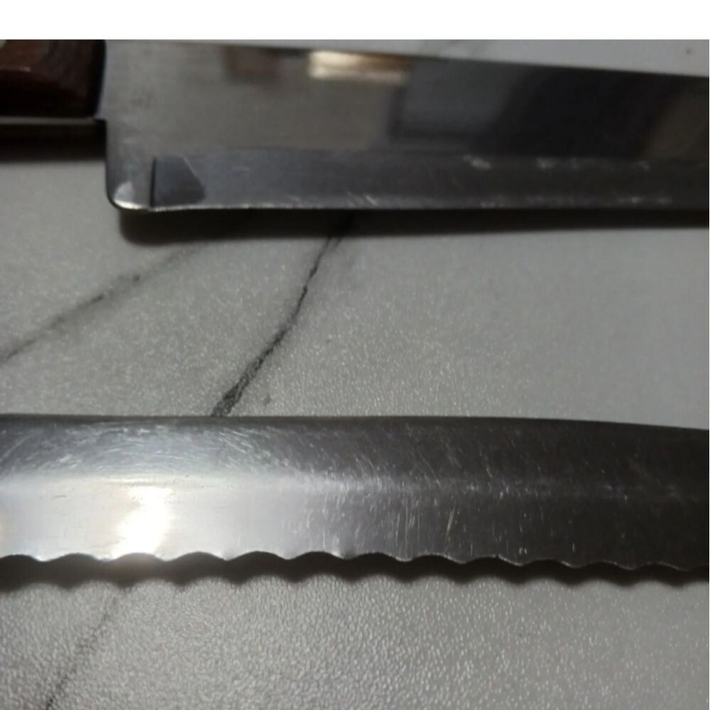 Pair of stainless steel Knives by Flint made in USA Surface scratches Partial